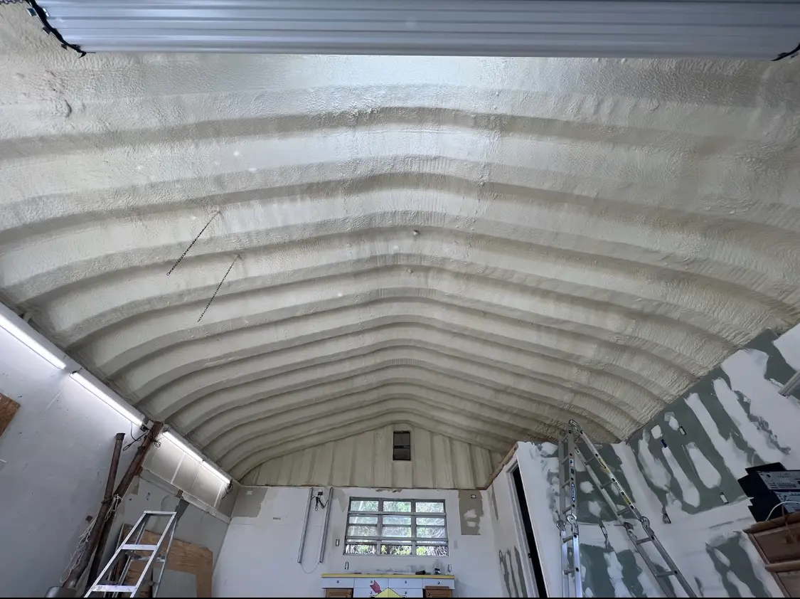 Spray polyurethane foam applied to the underside of a metal roof deck in Kayenta